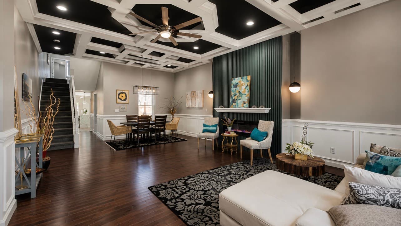 Finished Jobi Homes living room renovation with coffered ceiling and fireplace